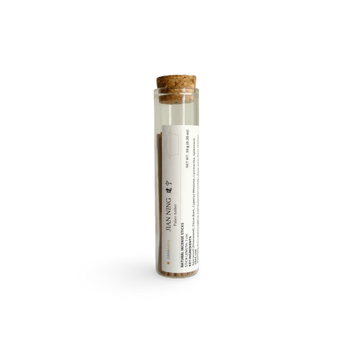 Jianning Palace Amber 10 g glass tube with a cork stopper and short coreless incense sticks.
