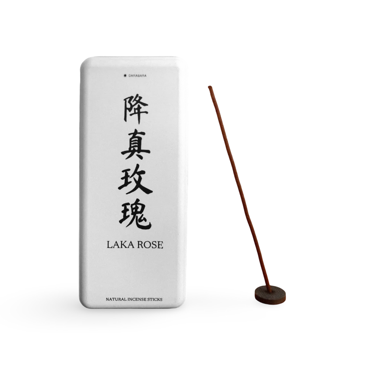 Laka Rose paper incense box beside a coreless incense stick in a small round holder.