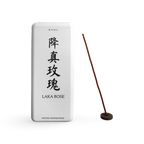 Laka Rose paper incense box beside a coreless incense stick in a small round holder.