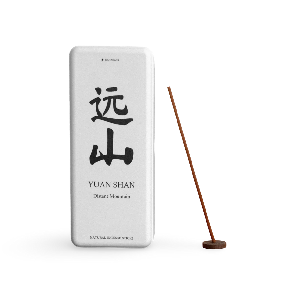 Yuan Shan paper incense box beside a coreless incense stick in a small round holder.