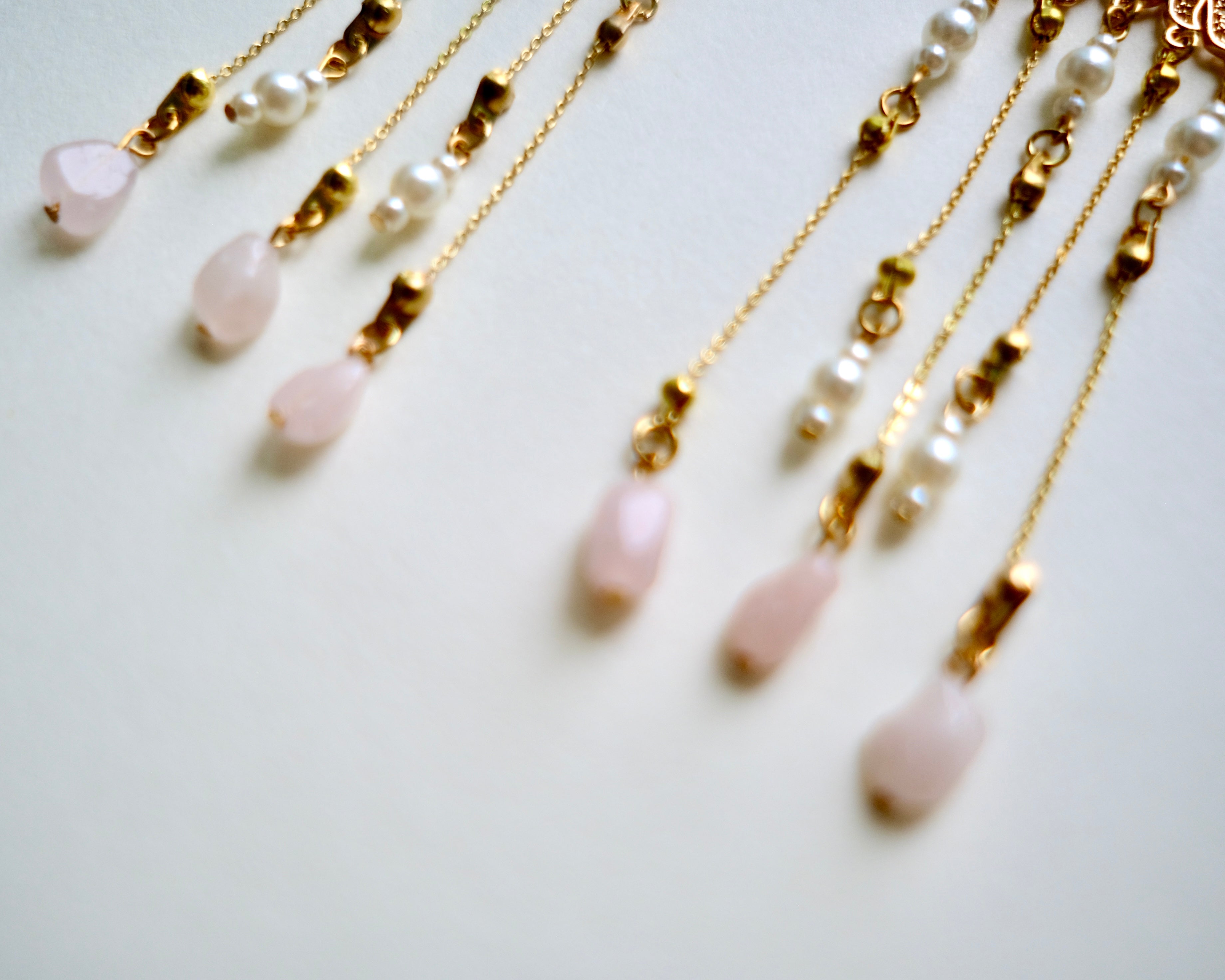 Close up shot of the Pink Chandelier Handmade Earrings, New Chinese "Traditional" style by Jian.