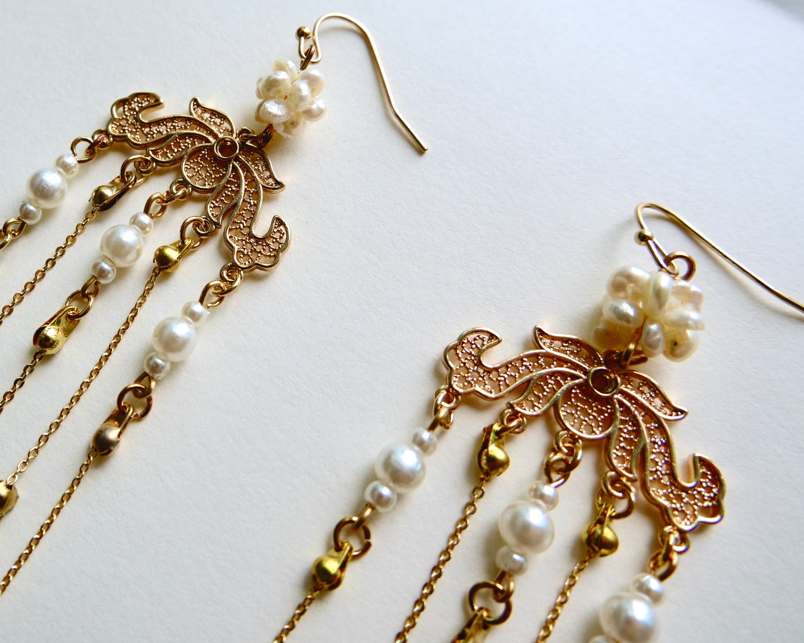 Close up shot of the handmade Pink Chandelier earrings by Jian.
