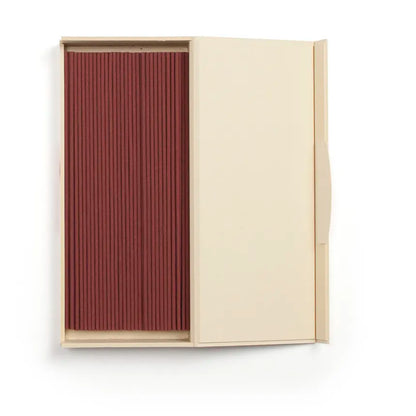 Beige box with a red incense sticks on a white background from Shoyeido
