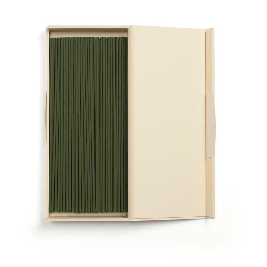 Beige box with green incense sticks inside on a white background, from Shoyeido Incense