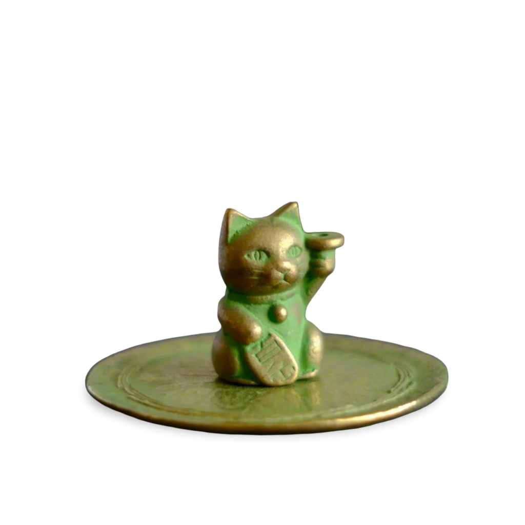 Oxidated copper color cat-shaped incense stand on a transparent background