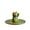 Oxidated copper color cat-shaped incense stand on a transparent background