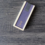 Purple wooden with Kousaido Hitotoki brand logo on a wooden surface