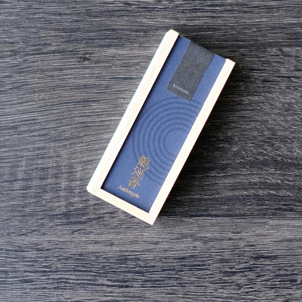 Blue box of incense with a Kousaido brand logo on a wooden surface