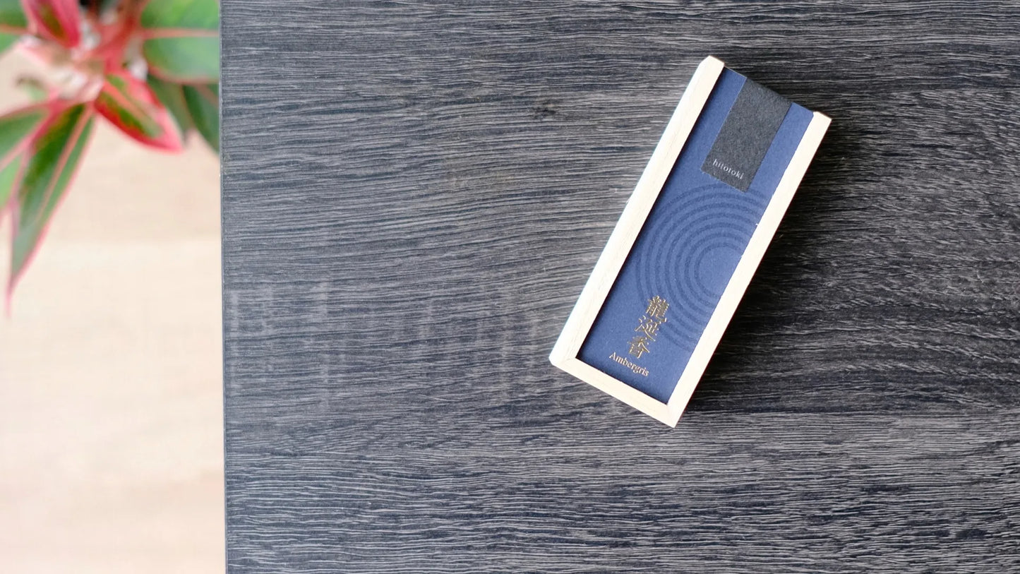 Blue box of incense with a kousaido brand logo on a wooden surface