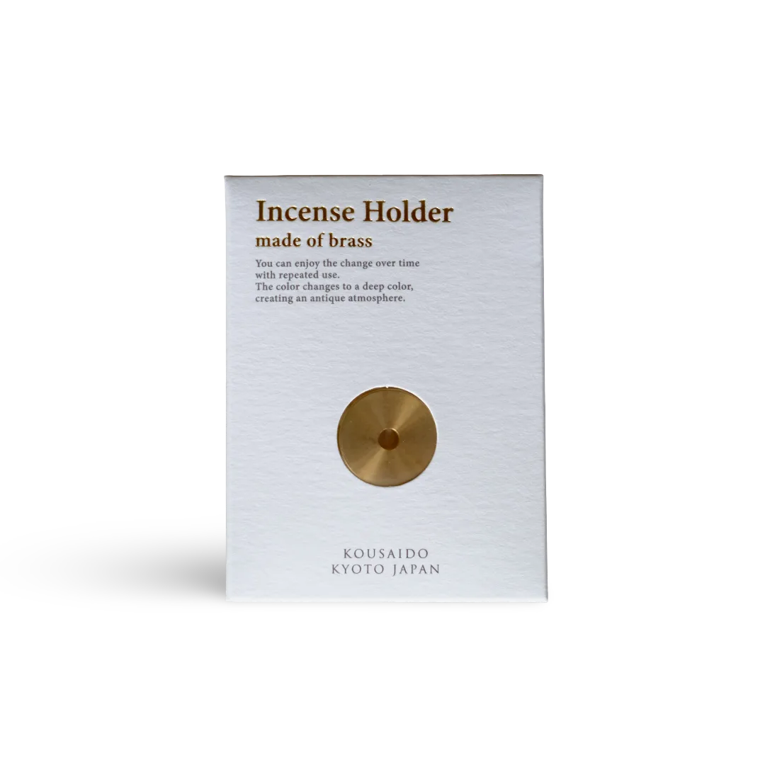 Brass incense holder packaging with text on a white background