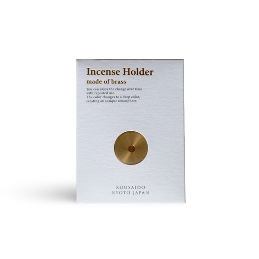 Brass incense holder packaging with text on a white background