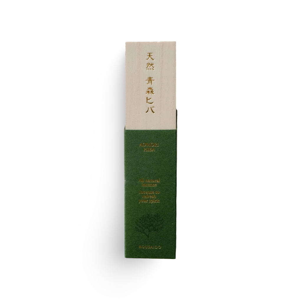 Green and beige incense product packaging with text on a white background