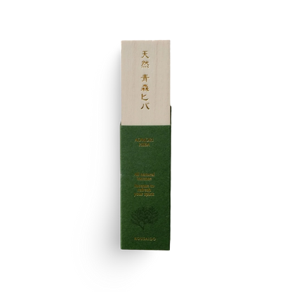 Green and beige incense product packaging with text on a white background