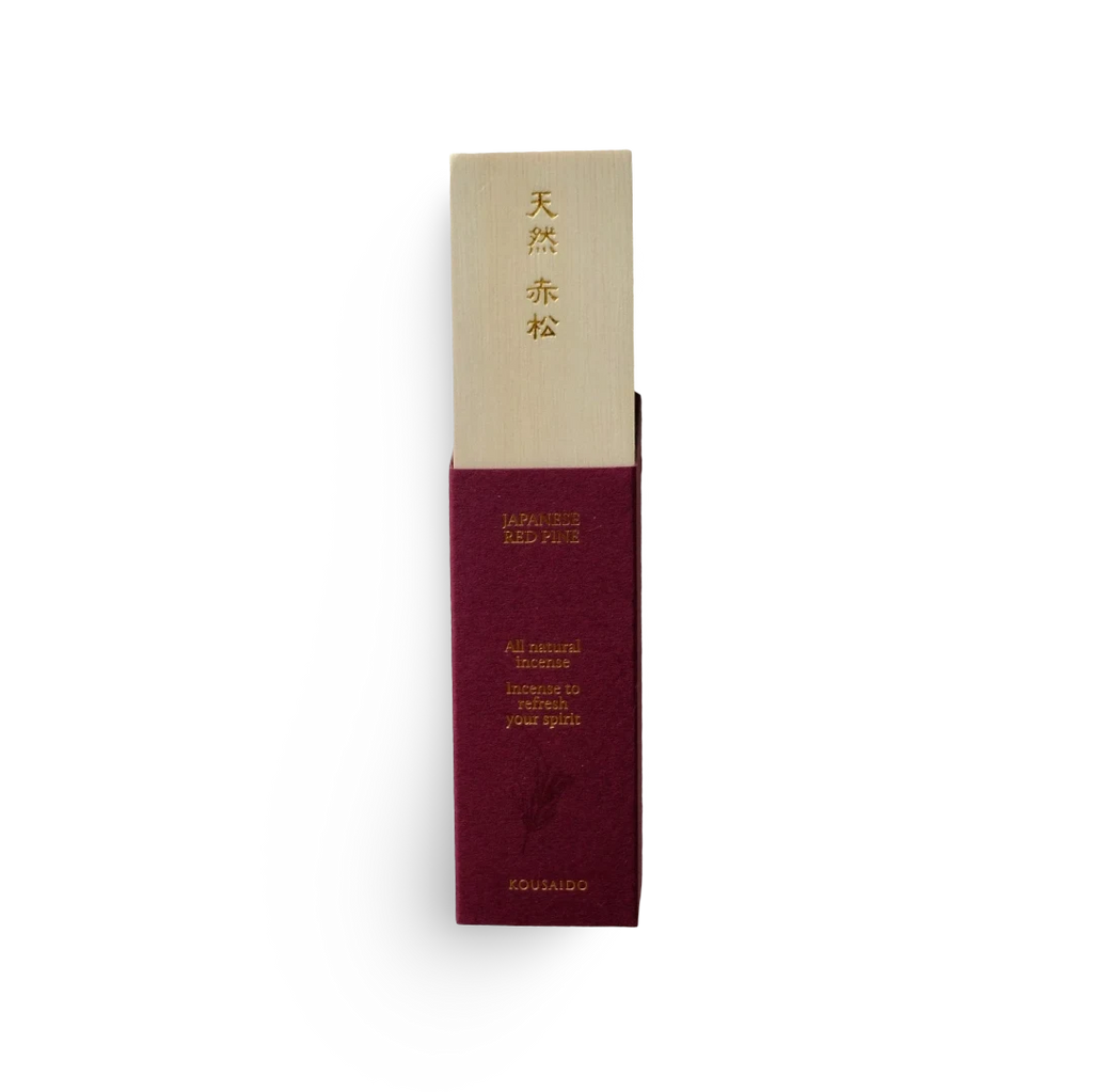 Maroon and beige incense packaging with text on a white background