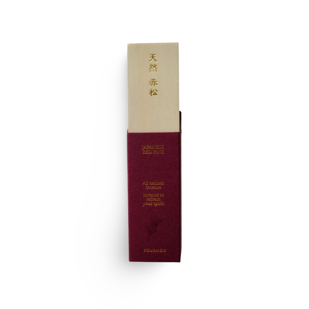 Maroon and beige incense packaging with text on a white background