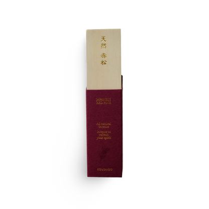 Maroon and beige incense packaging with text on a white background