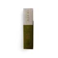Green and beige incense product packaging with text on a white background