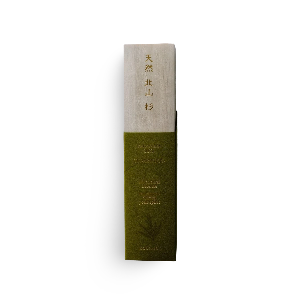 Green and beige incense product packaging with text on a white background