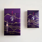 Two purple packaging boxes of Kunjudo ruby Takara incense with gold accents on a white background