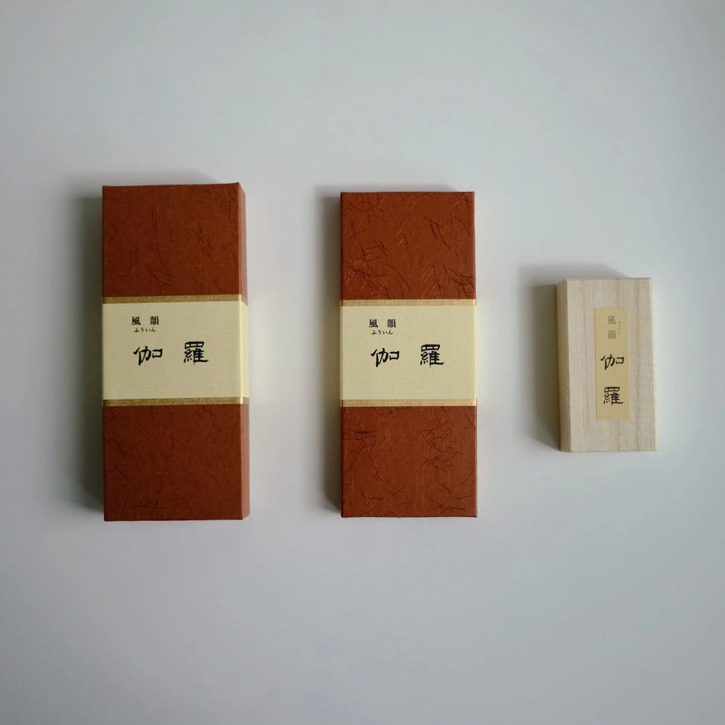 Three sizes of fuin kyara incense boxes with brown and beige design on a light gray background