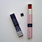 A box of opened KAYURAGI - Cherry Blossom 40 sticks, incense holder outside the box, and another box showing opposite text of the incense package. white background.