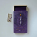 Purple oedo koh aloeswood incense box with open lid showing purple sticks on a light gray background