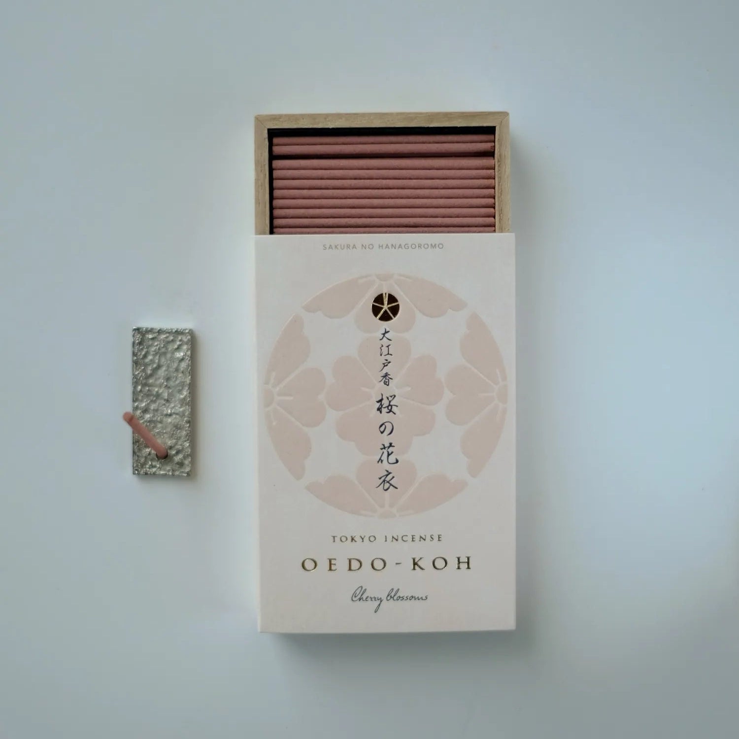 Oedo Koh cherry blossom incense box with incense sticks on a light gray background