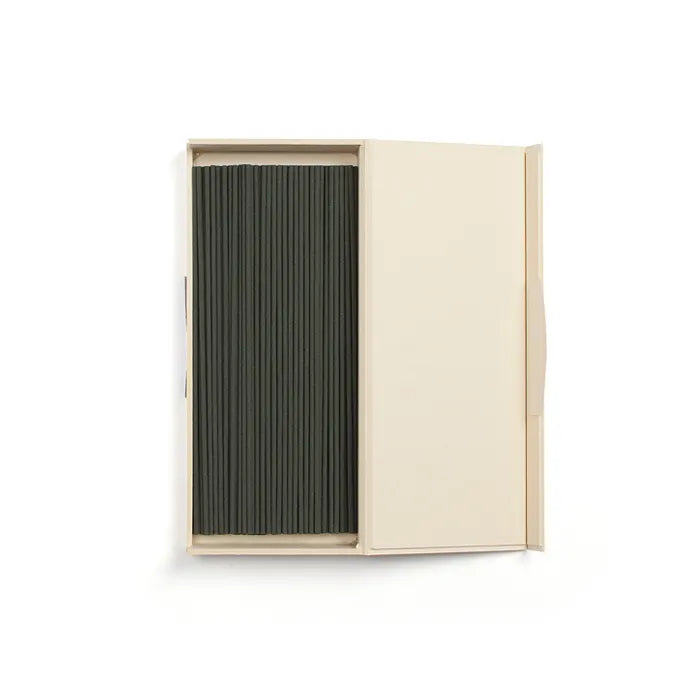 Beige box opened displaying black incense sticks on a white background