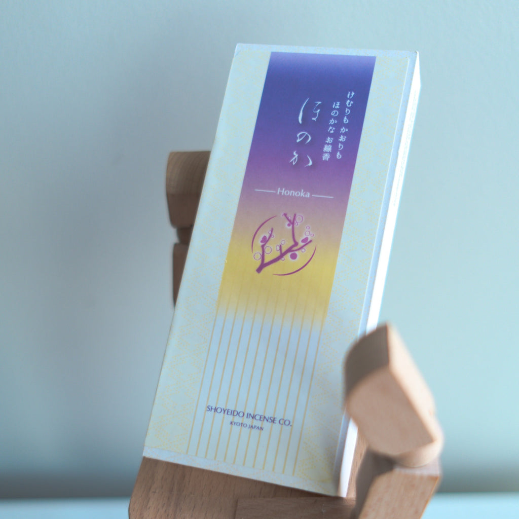 Incense packaging with a gradient design and Shoyeido brand name on a light background